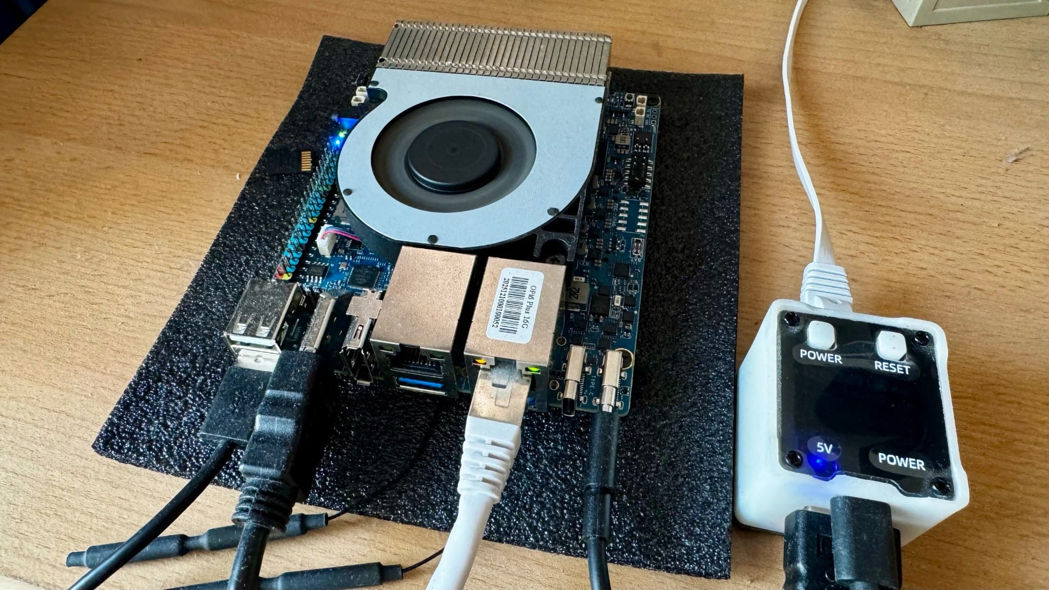 The Orange Pi 6+ on a corner of my desk