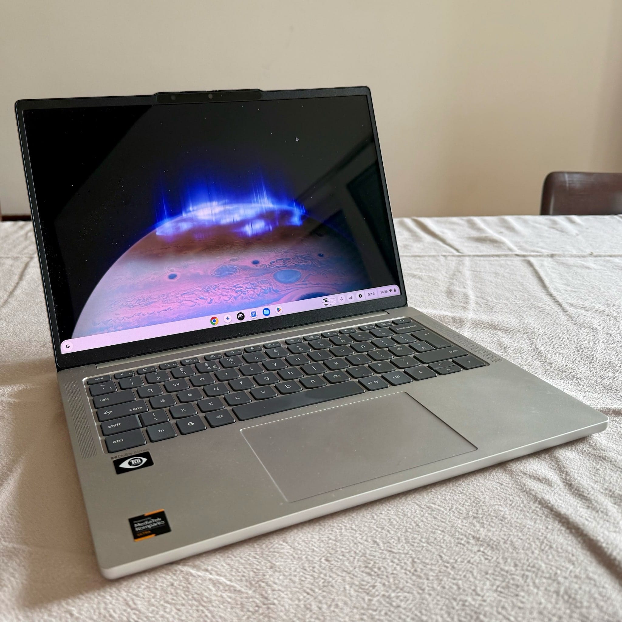 Lenovo Chromebook Plus open on a table, with ChromeOS on its OLED display