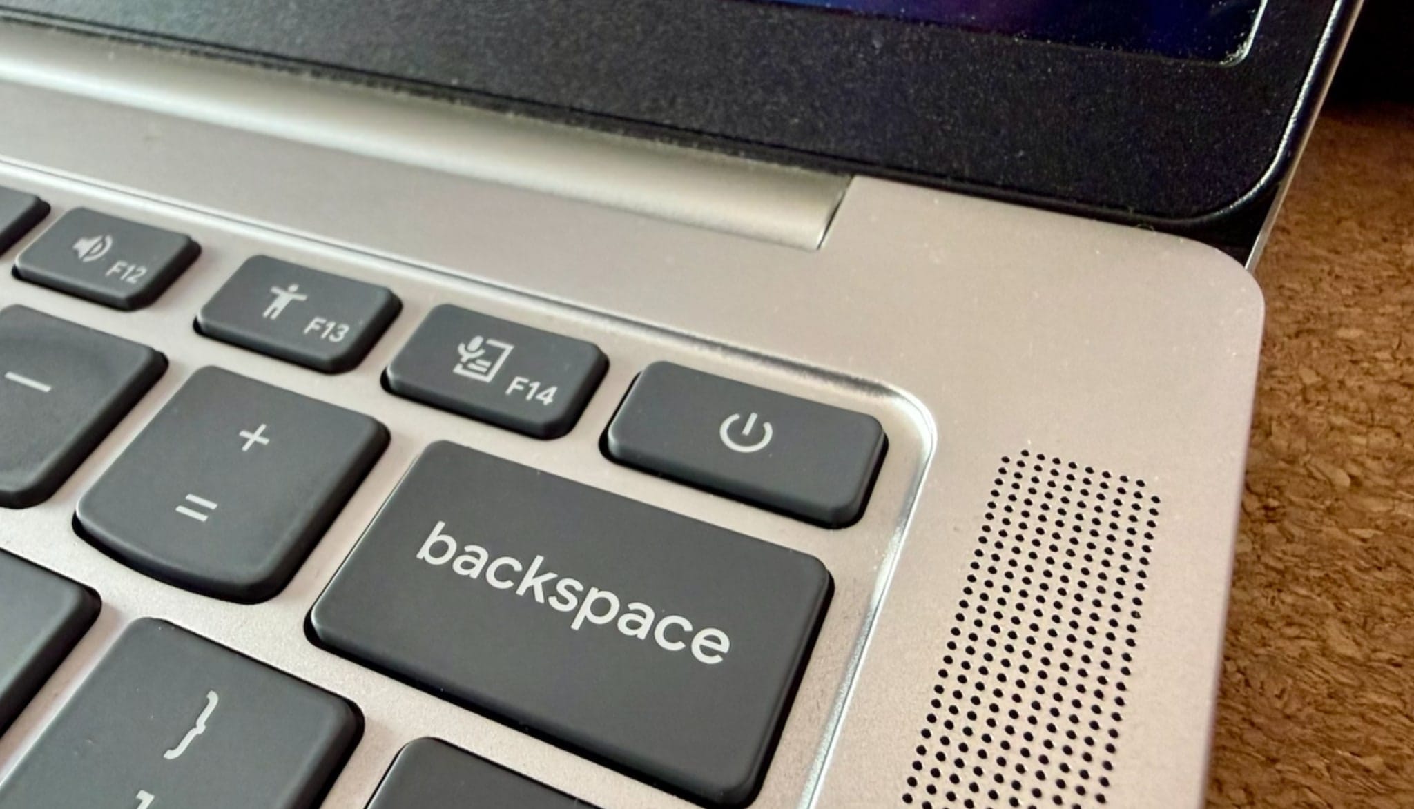Accessibility and dictation keys beside the power button and right speaker grille